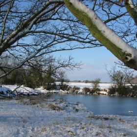 snowy pond and fields